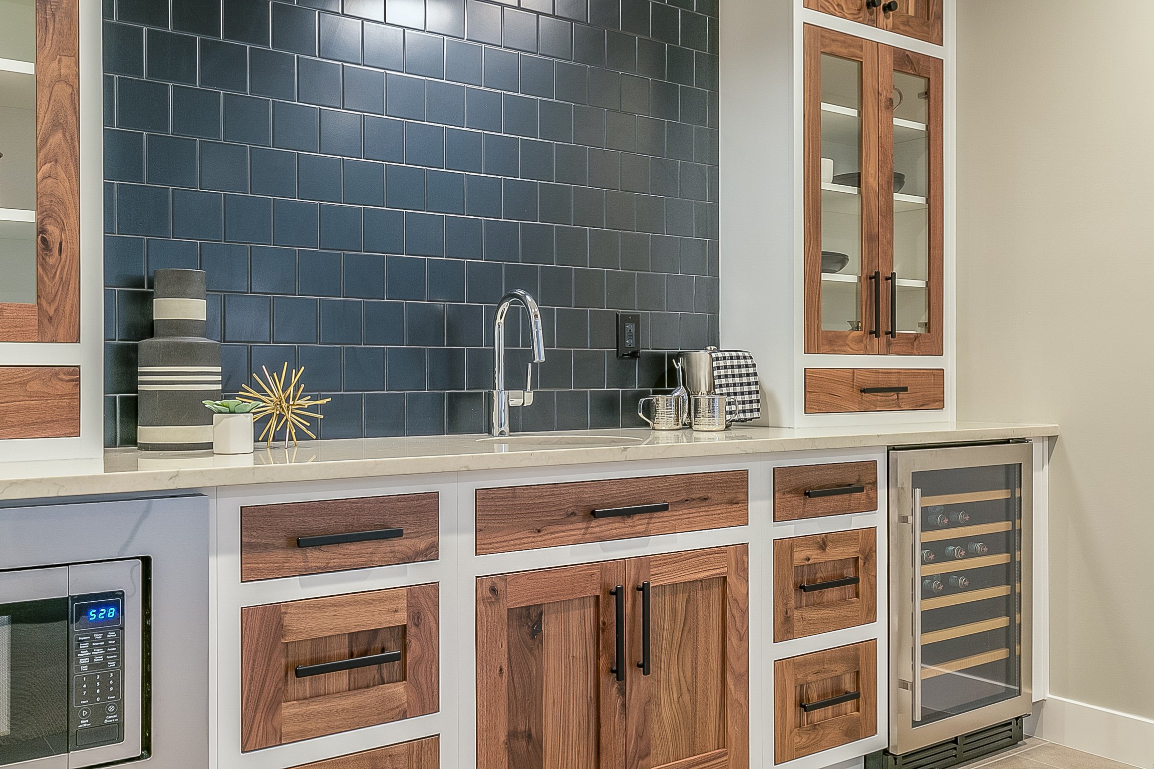 Beautiful kitchenette with blue tile backsplash